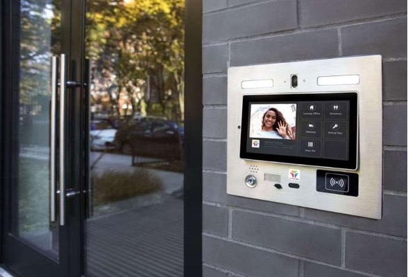 IP video intercom and access control terminal with card reader at a building entrance
