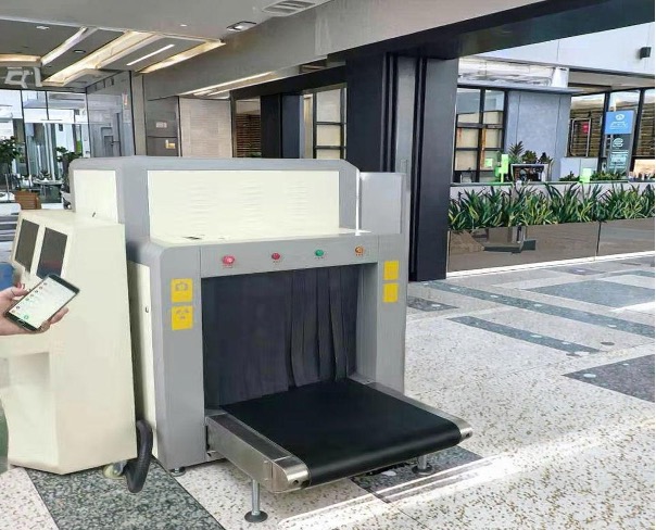 Luggage and baggage X-ray scanner deployed at a facility checkpoint