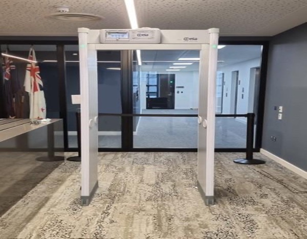 Walk-through metal detector archway installed at a secure entrance